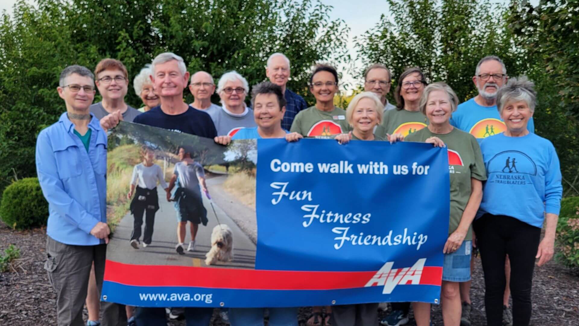 Fun Fitness Friendship banner held by group